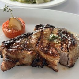 Porch and Parlor signature dishes Wagyu Steak, Seafood Tower, Louisiana Jambalaya Redfish, Millionaire's Potatoes, Butchers Bacon Rack